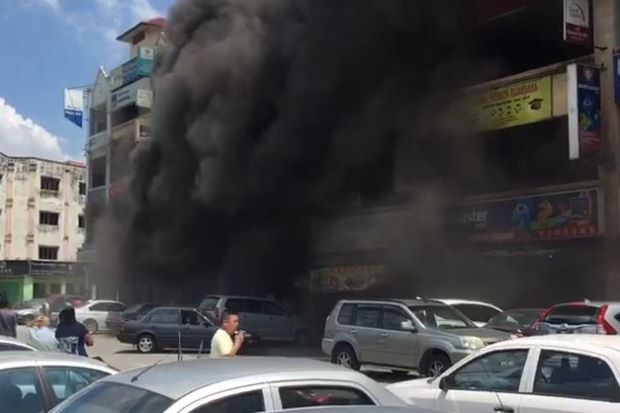 People scramble as motorbikes in shop explode one by one