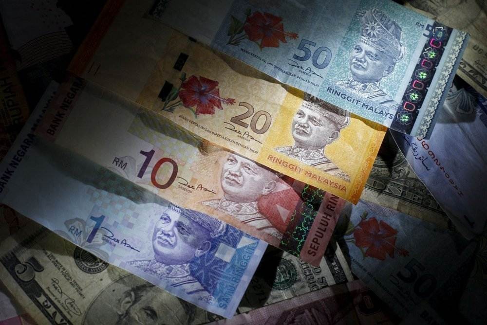 Ringgit opens higher against US dollar